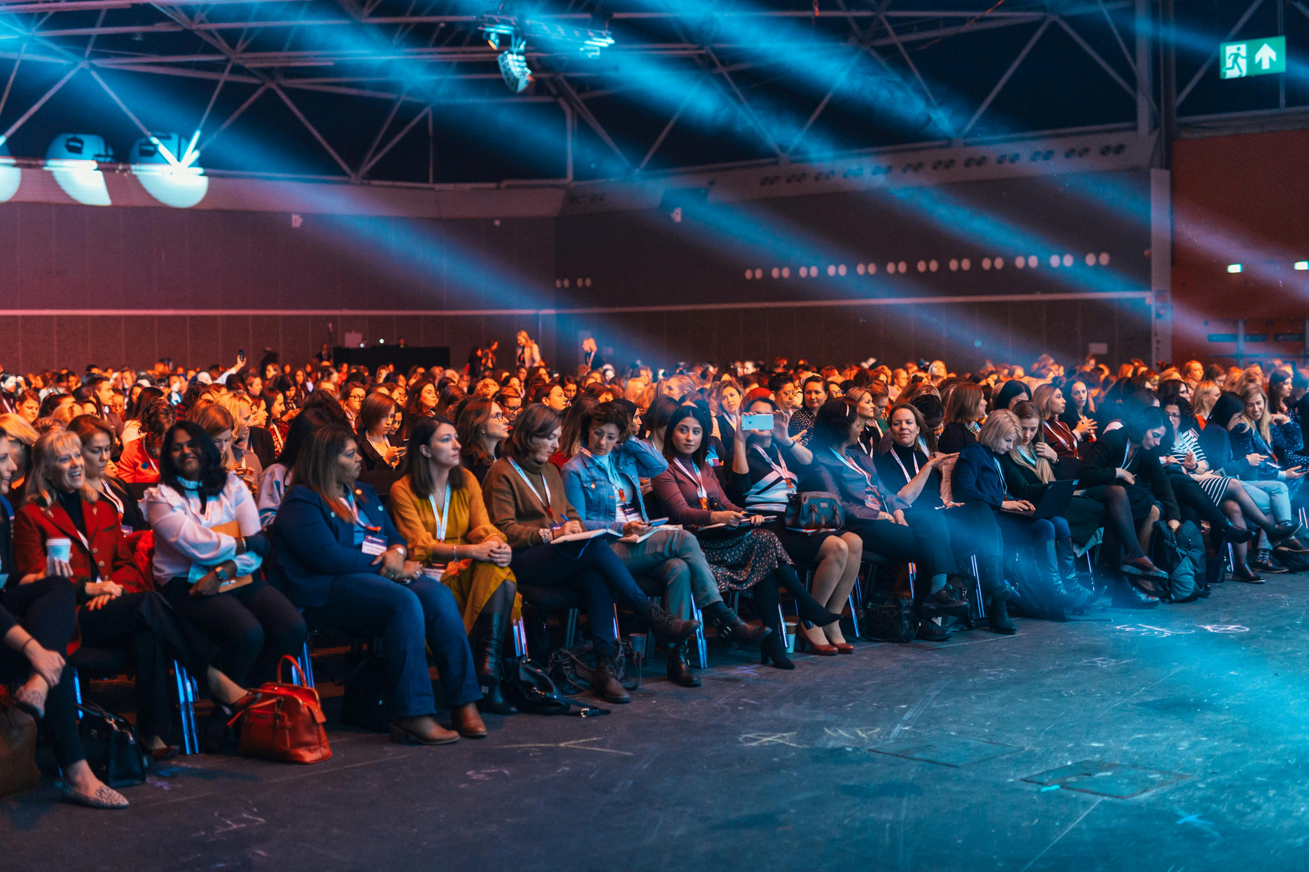 A workshop with many attendees seated